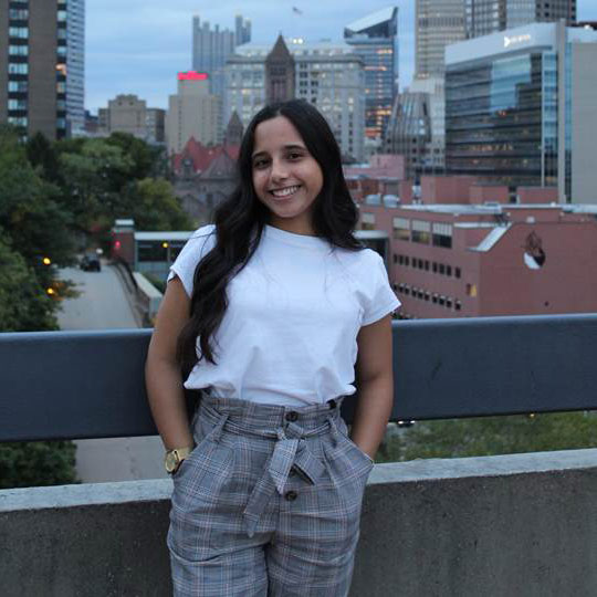 Maria Paula Quintero Headshot with Pittsburgh buildings in the background